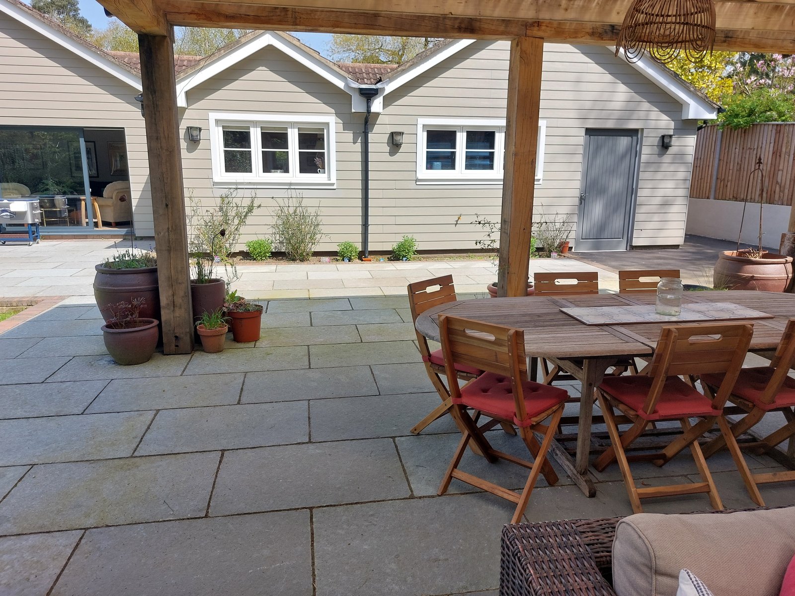 Garden room and landscaped garden viewed from the patio