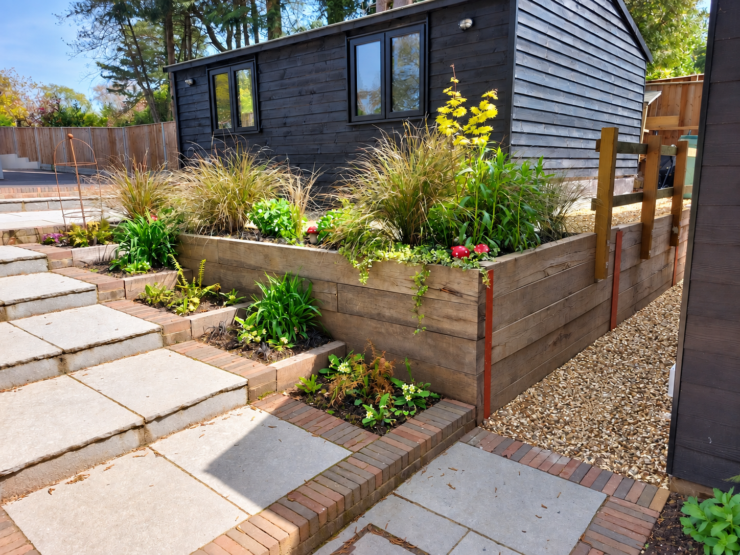 Garden room with Indian sandstone steps and landscaped levels