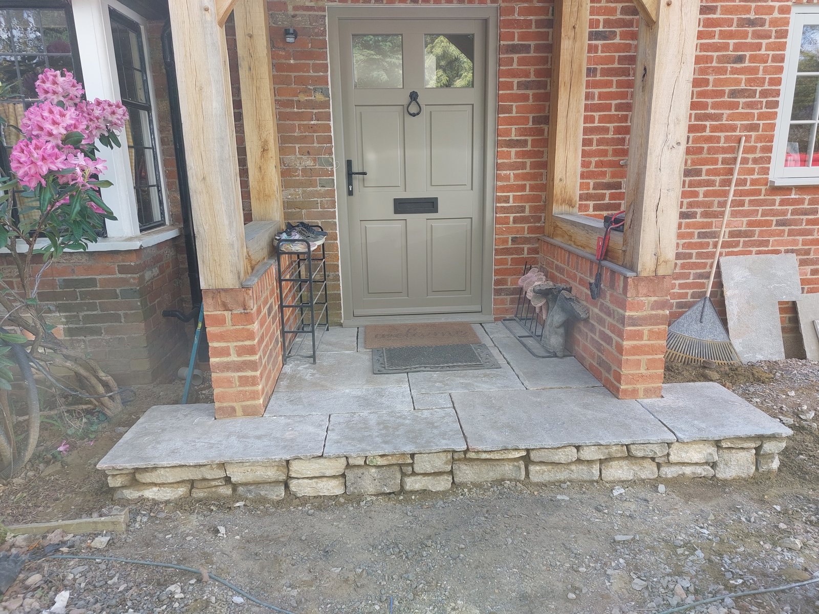 Limestone patio and natural stone landscaping at a private home in Godalming