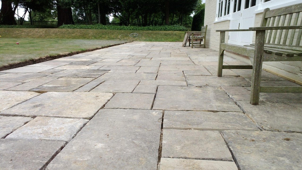 Reclaimed York stone walk through a brick-built pergola in Witley