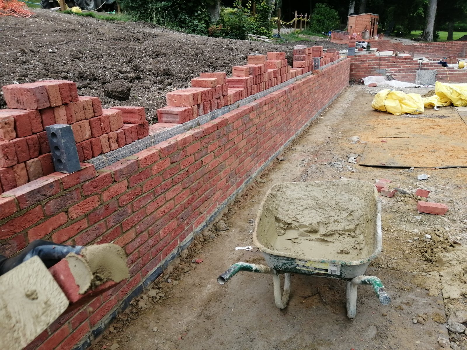 Red brick garden wall under construction in Haslemere