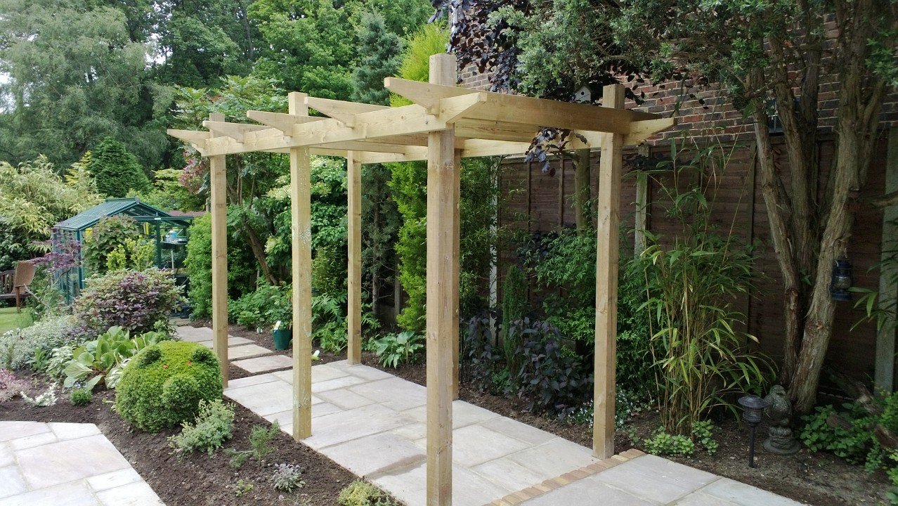 Softwood timber pergola and garden pathway in Grayshott