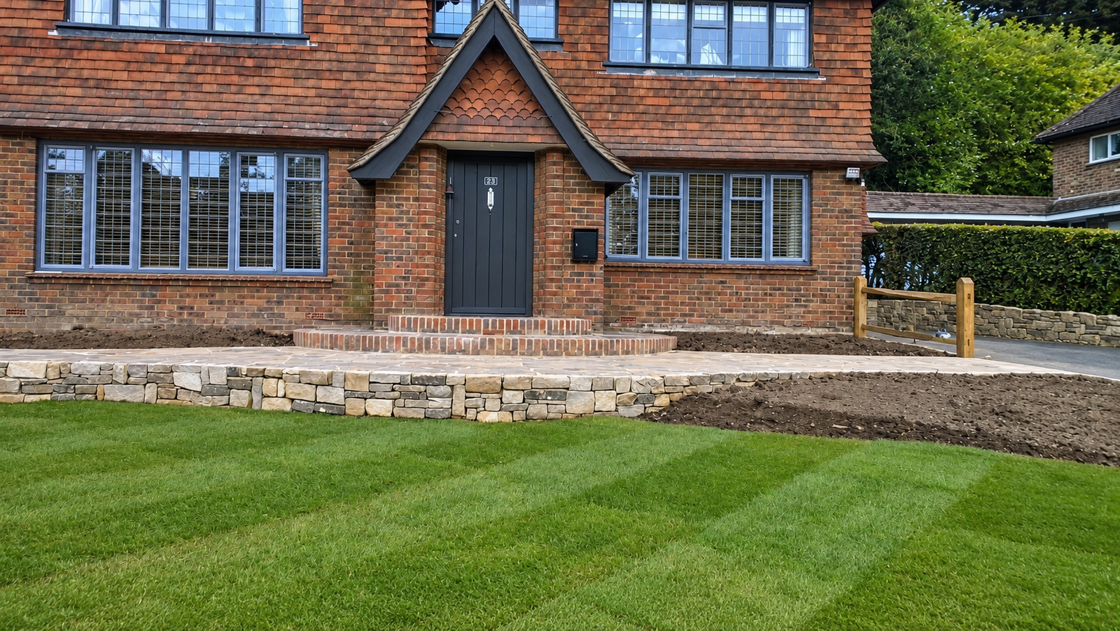 Natural stone wall with chestnut fencing