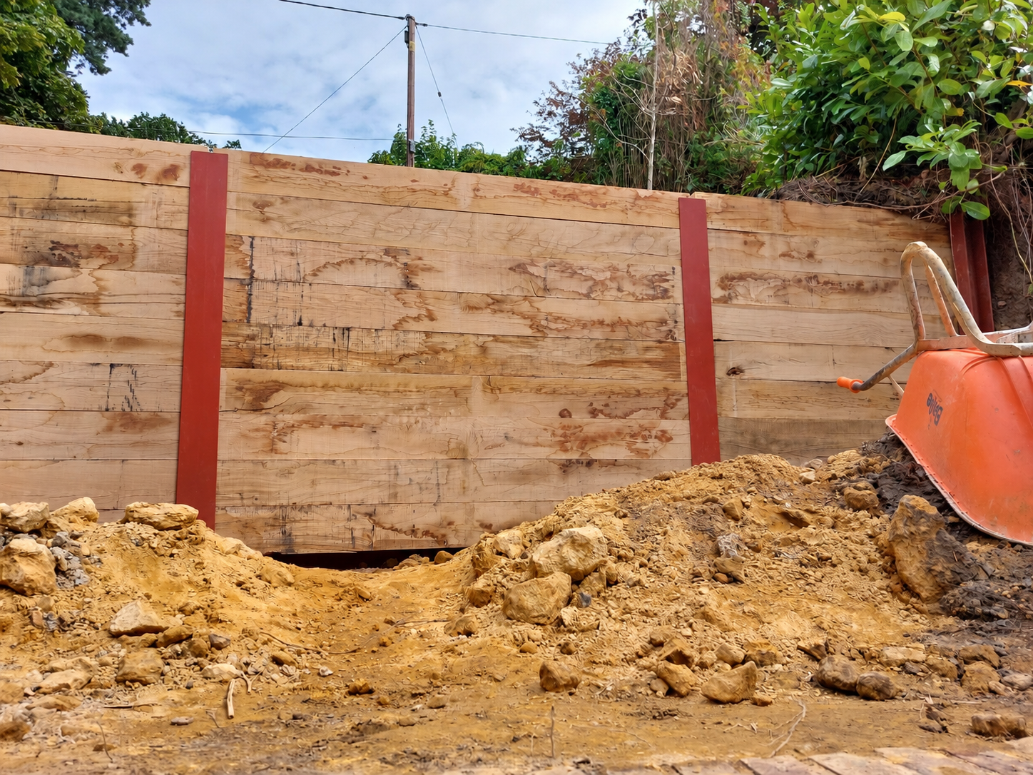 Steel RSJ sleeper retaining wall creating garden terraces in Haslemere
